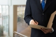 Businessman signing a document