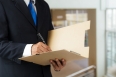 Businessman signing a document