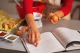 Closeup on happy young housewife preparing christmas dinner in kitchen